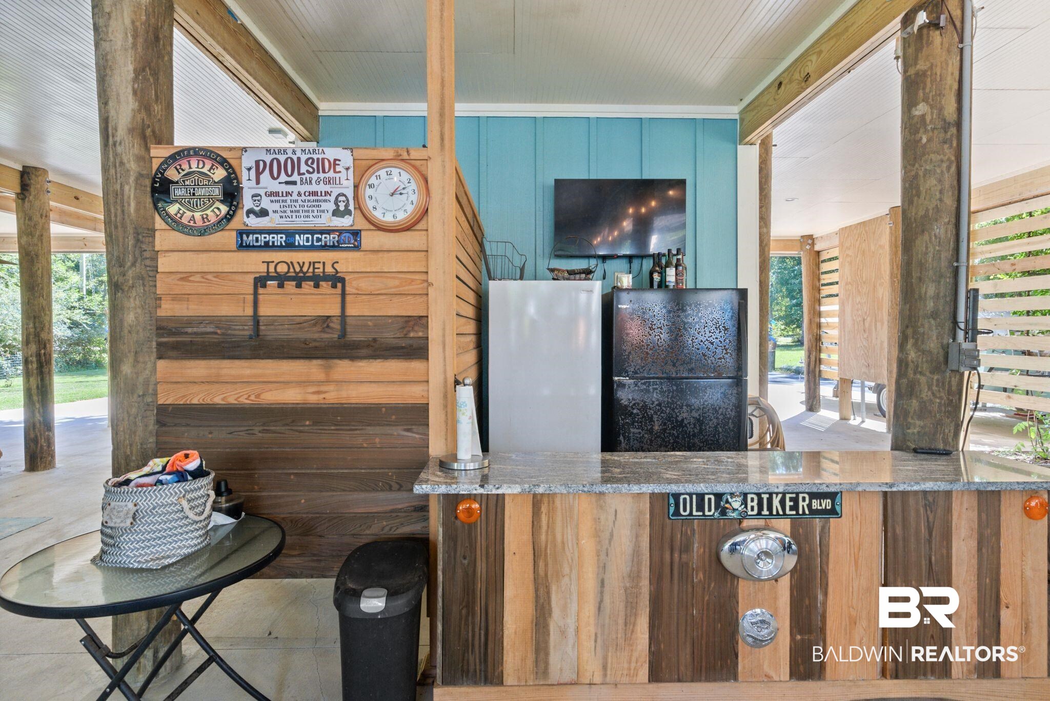 7266 Franklin Road Foley, AL 36535 - Photo 52 of 64 Outdoor bar area featuring a granite-style countertop, wood-finish paneling, an integrated flat-screen television, and multiple built-in appliances