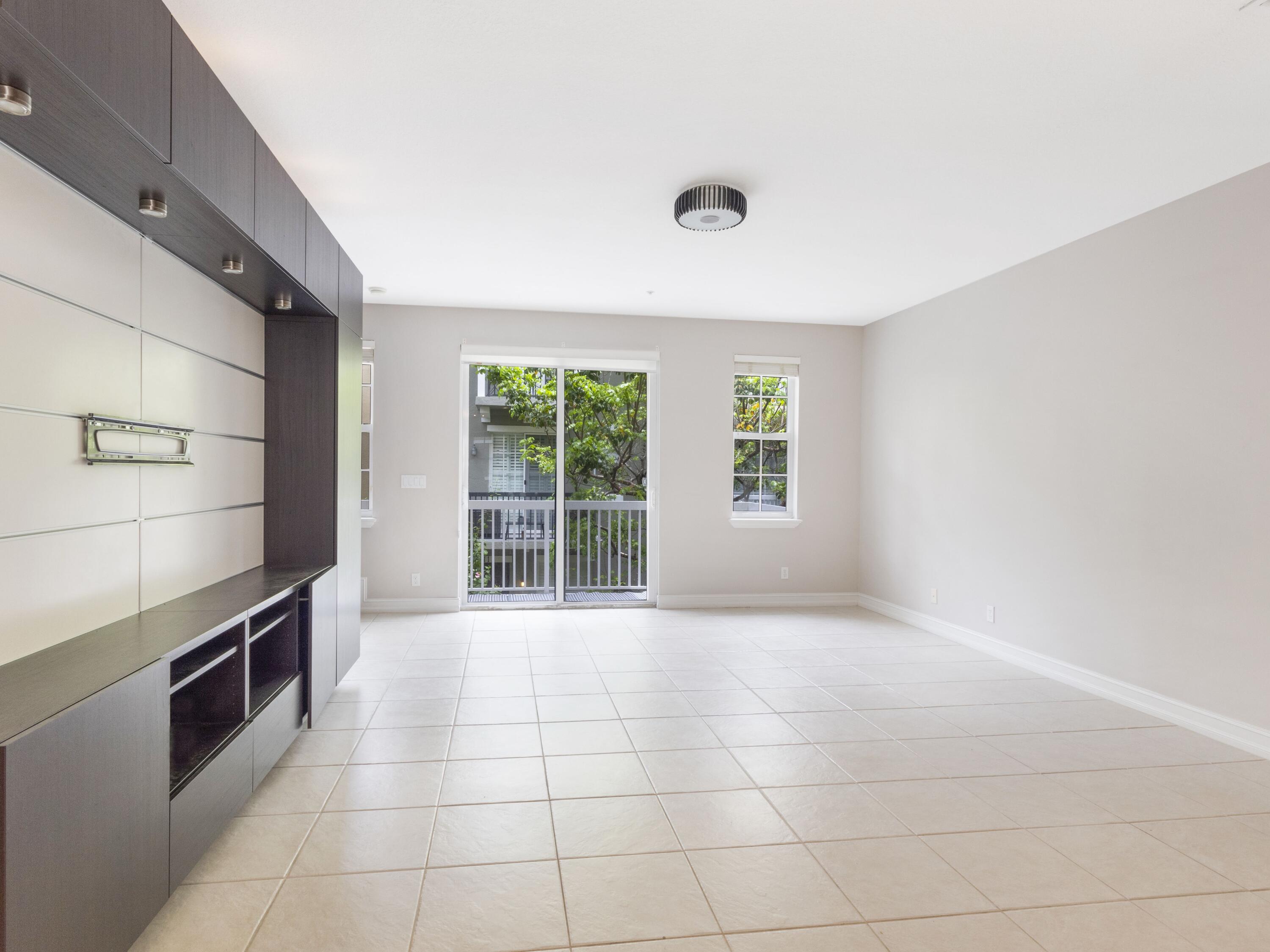 110 West Coda Circle, Unit 110 Delray Beach, FL 33444 - Photo 17 of 42 a view of a kitchen with an empty space and window