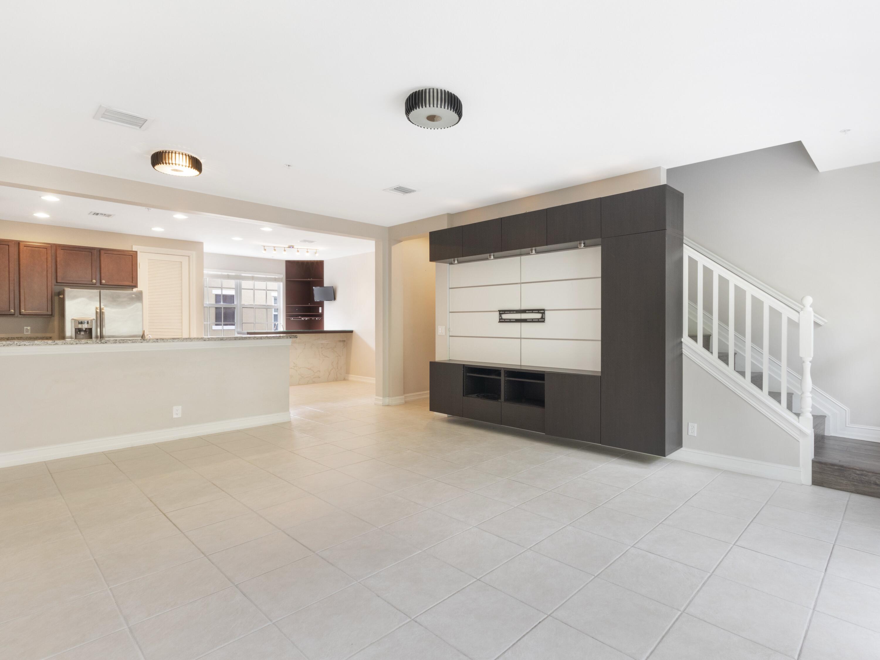 110 West Coda Circle, Unit 110 Delray Beach, FL 33444 - Photo 18 of 42 a view of an empty room with kitchen and a window