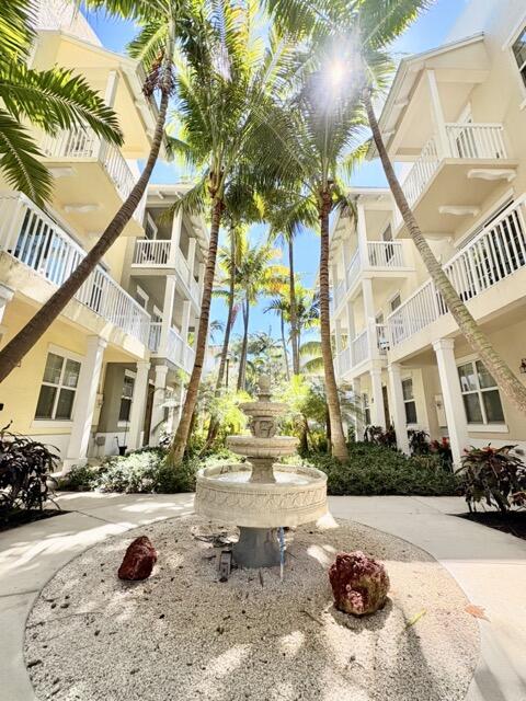110 West Coda Circle, Unit 110 Delray Beach, FL 33444 - Photo 2 of 42 a view of a street with a building in the background