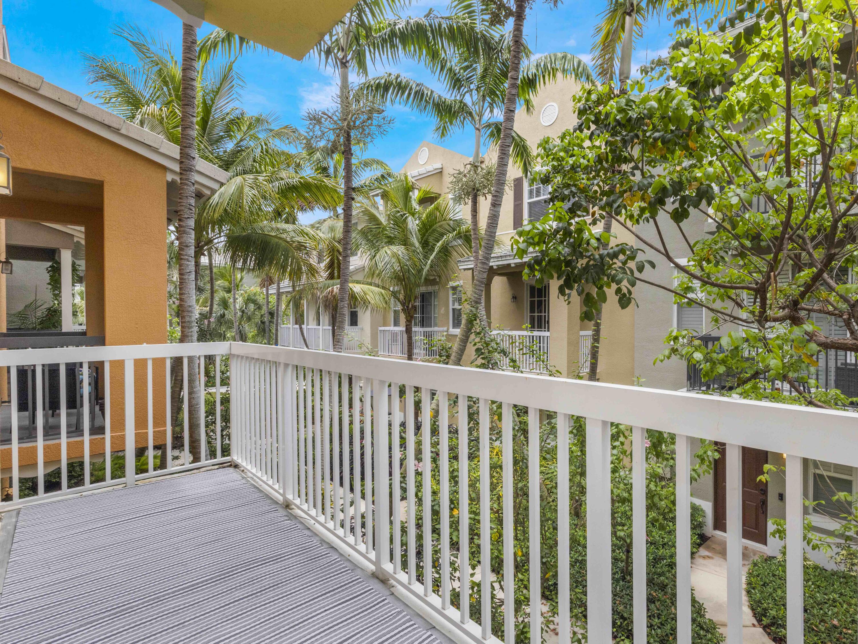 110 West Coda Circle, Unit 110 Delray Beach, FL 33444 - Photo 22 of 42 a view of a wooden fence