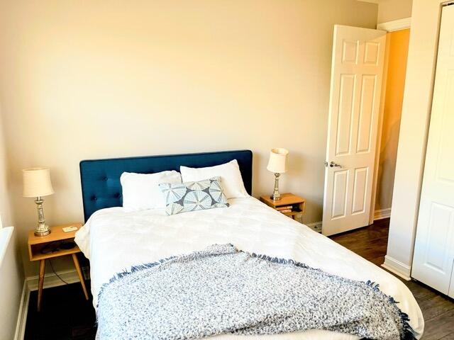 110 West Coda Circle, Unit 110 Delray Beach, FL 33444 - Photo 26 of 42 a large white bed in a small room next to a window