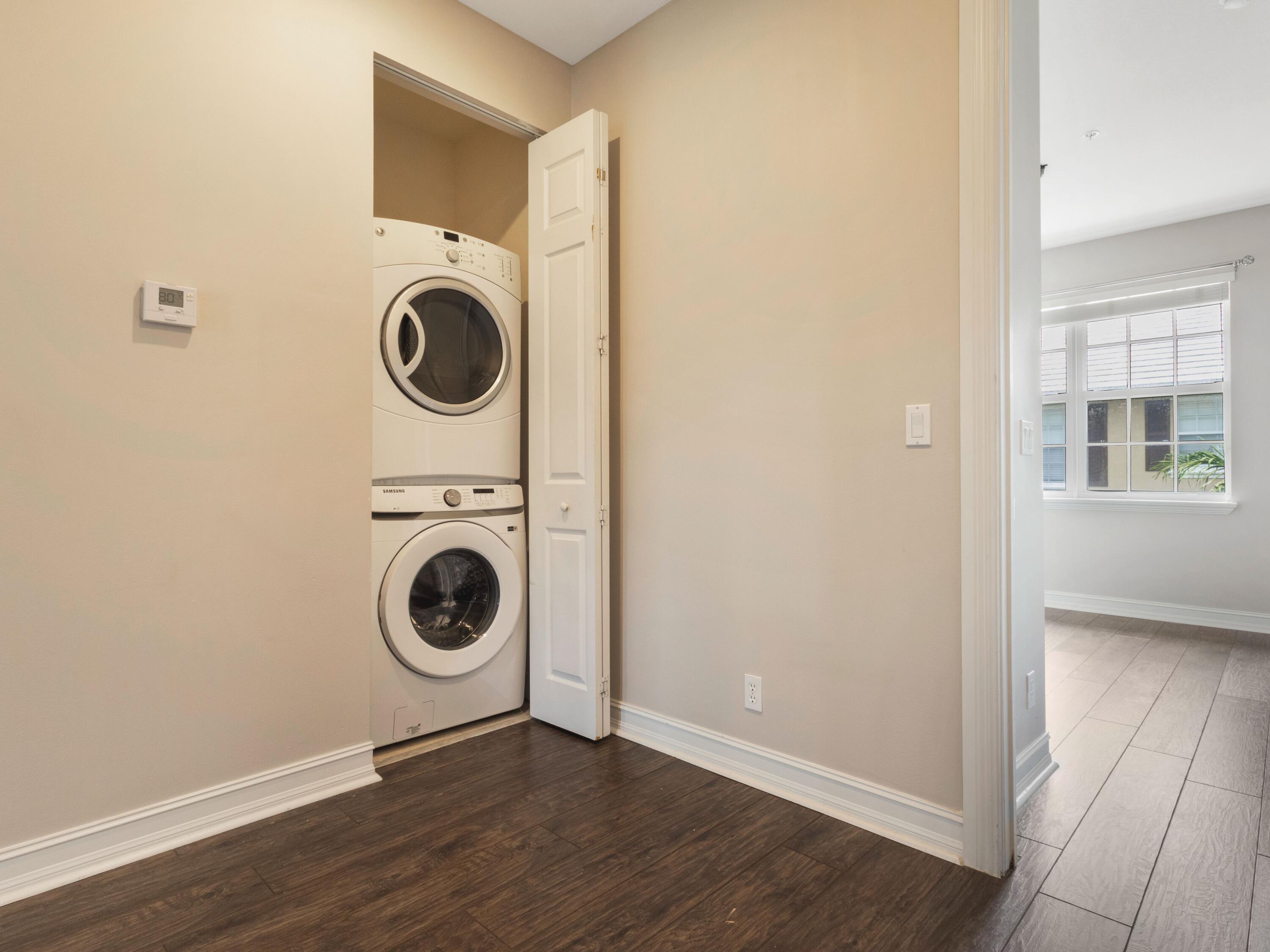 110 West Coda Circle, Unit 110 Delray Beach, FL 33444 - Photo 27 of 42 a view of a storage and utility room with washer and dryer