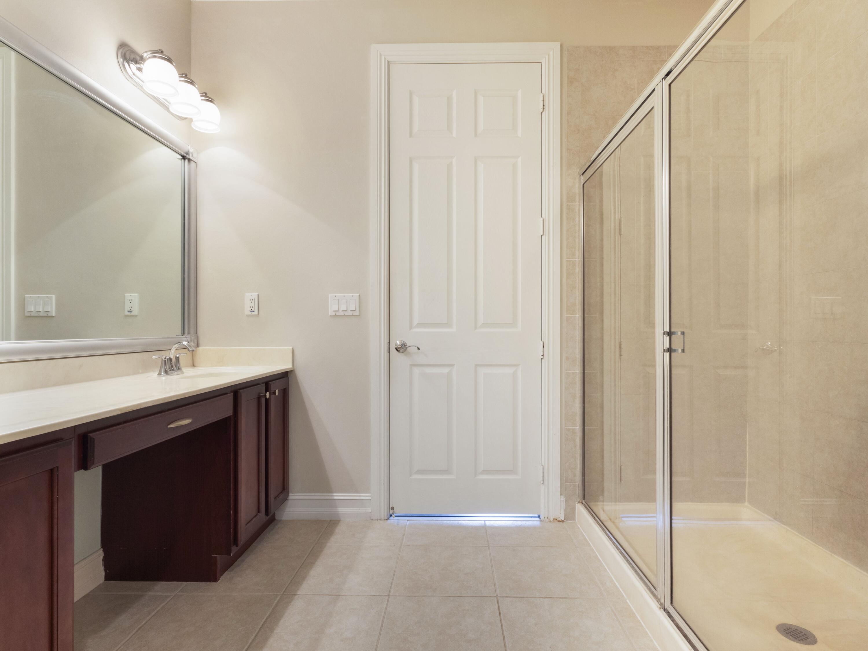 110 West Coda Circle, Unit 110 Delray Beach, FL 33444 - Photo 33 of 42 a spacious bathroom with a shower and a sink