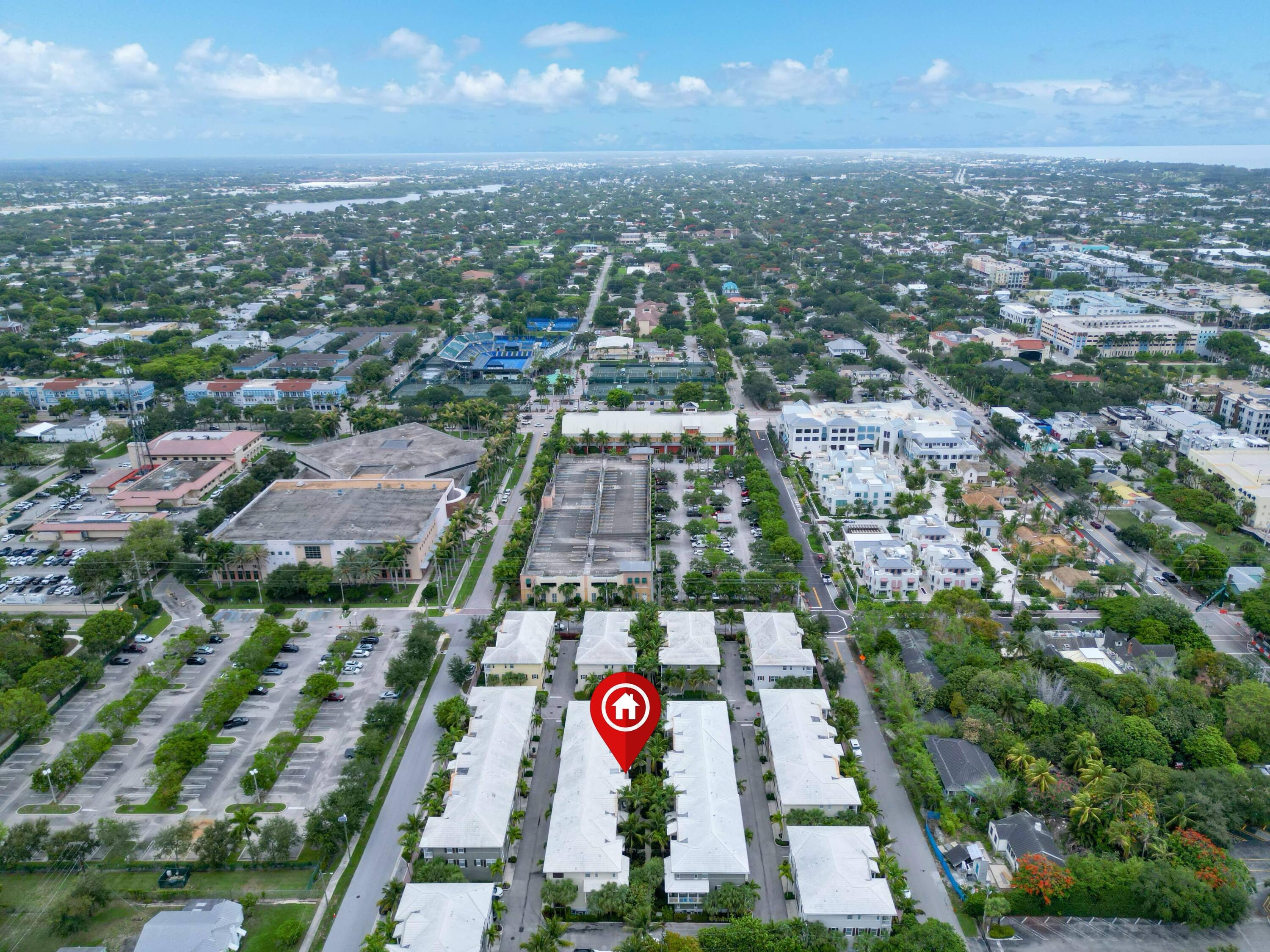 110 West Coda Circle, Unit 110 Delray Beach, FL 33444 - Photo 41 of 42 an aerial view of multi story residential apartment building with green space