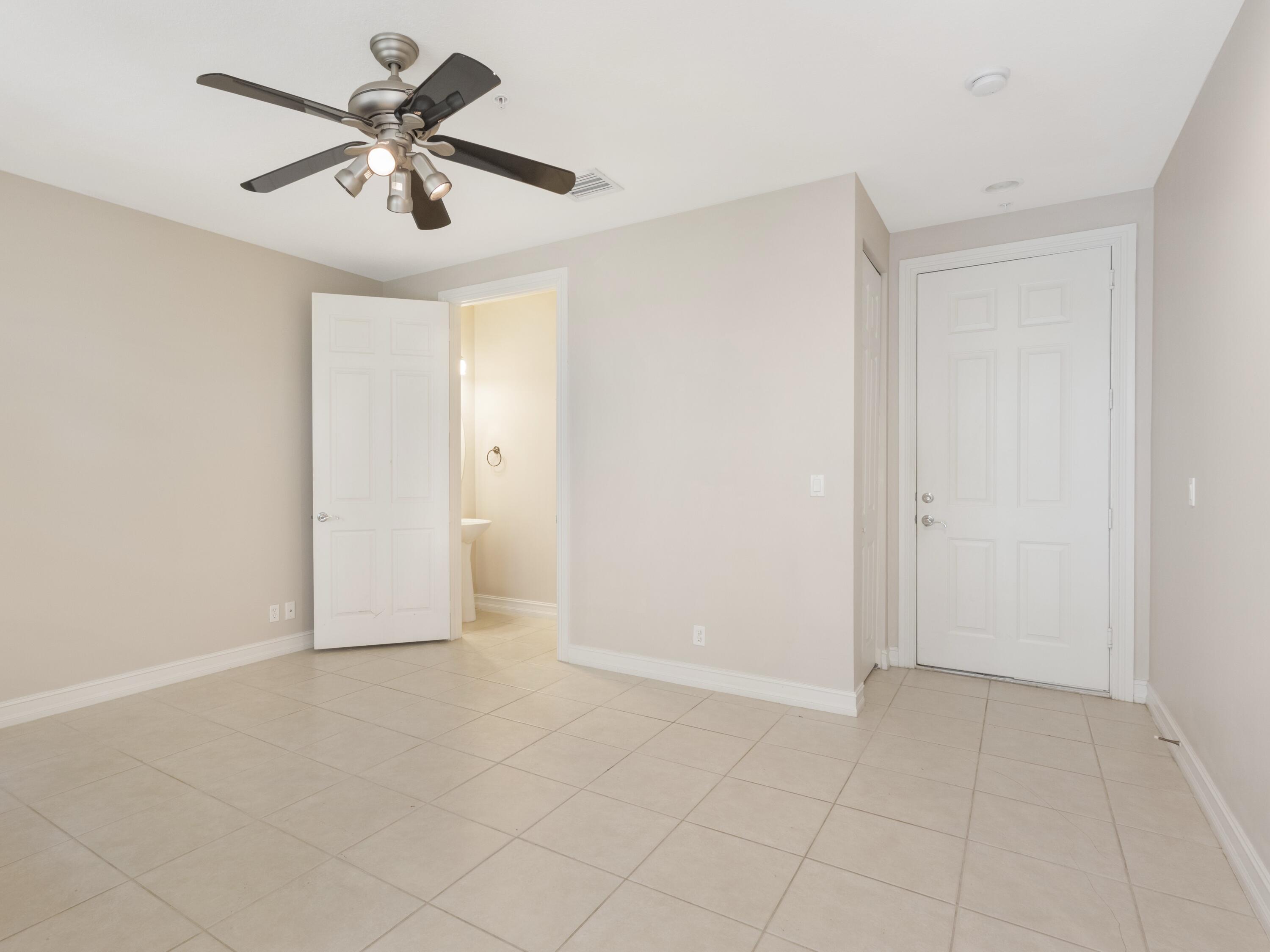 110 West Coda Circle, Unit 110 Delray Beach, FL 33444 - Photo 7 of 42 an empty room with fan