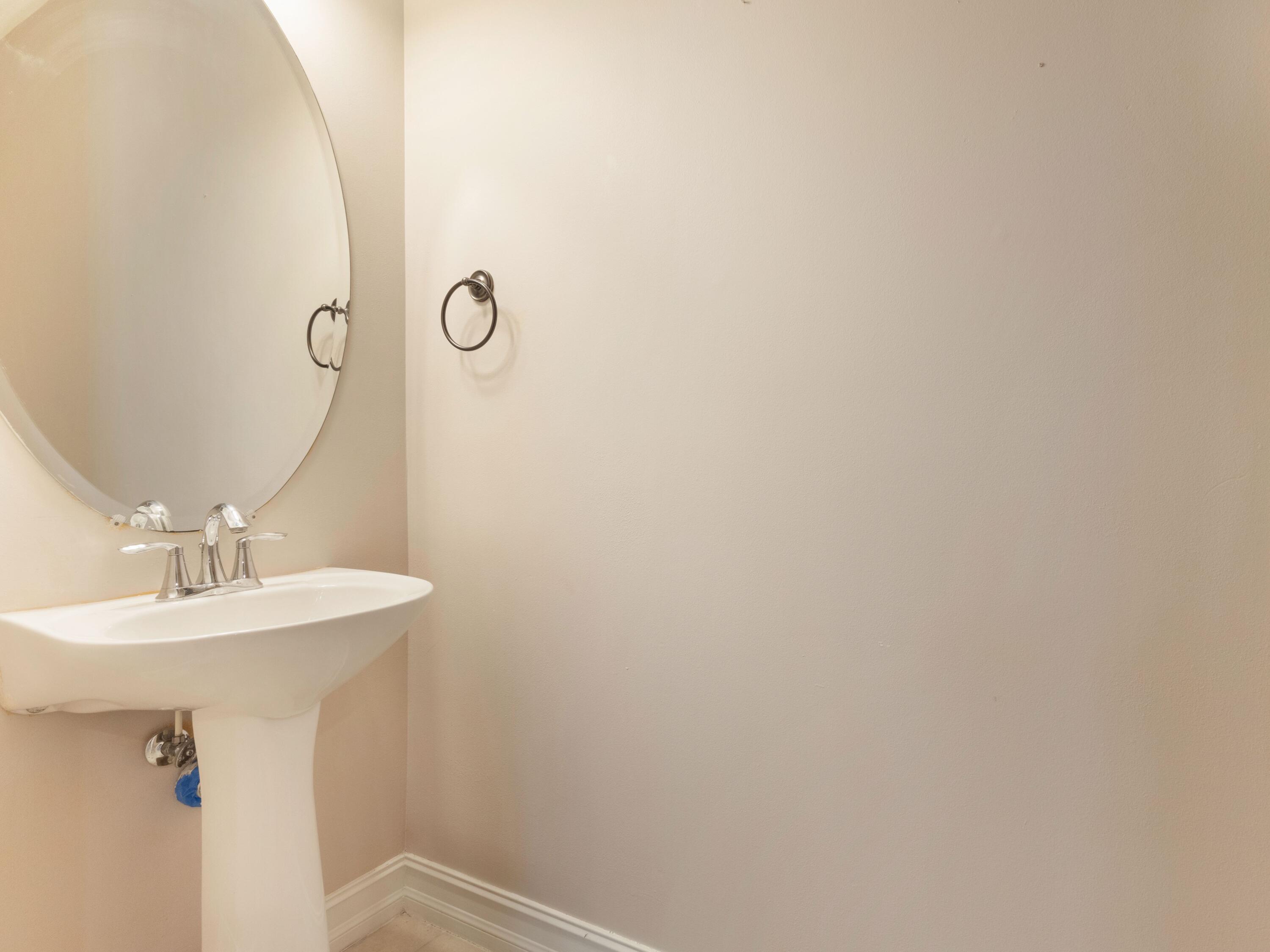110 West Coda Circle, Unit 110 Delray Beach, FL 33444 - Photo 9 of 42 a bathroom with a sink a mirror and vanity
