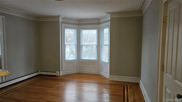 a kitchen with stainless steel appliances white cabinets and a stove top oven
