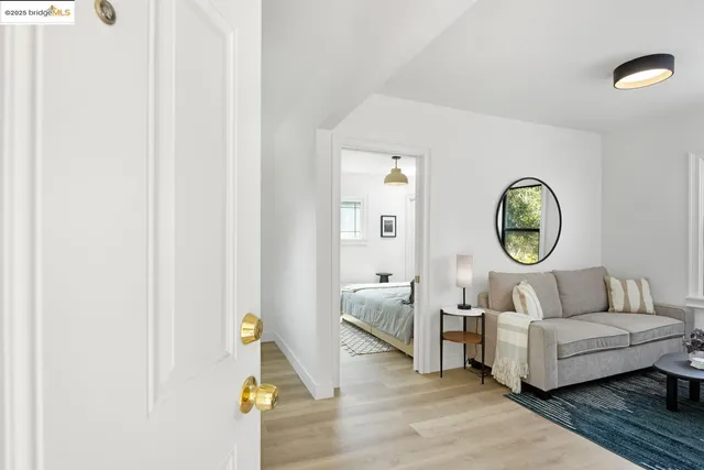a living room with furniture and a clock