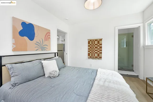 a bedroom with a large bed and a couch