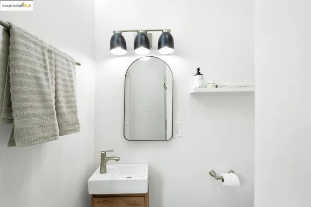 a bathroom with a sink and mirror