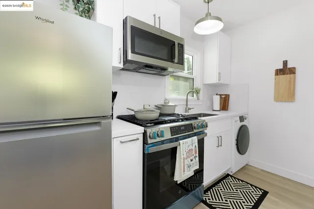 a kitchen with a stove and a microwave