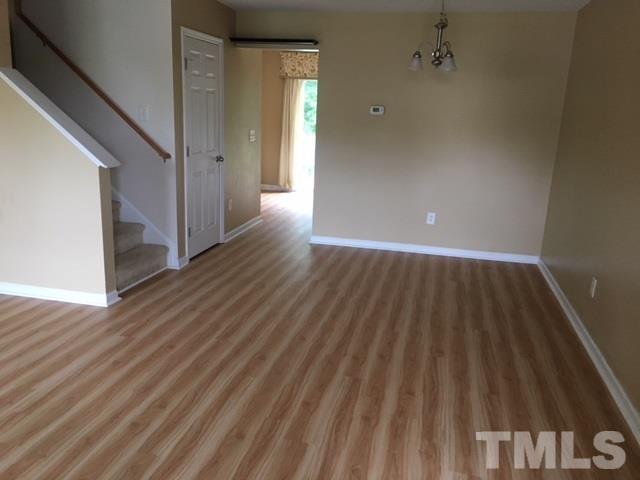 3645 Bison Hill Lane Raleigh, NC 27604 - Photo 3 of 9 a view of a hallway with wooden floor