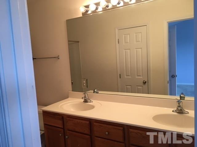 3645 Bison Hill Lane Raleigh, NC 27604 - Photo 8 of 9 a bathroom with a sink and a mirror