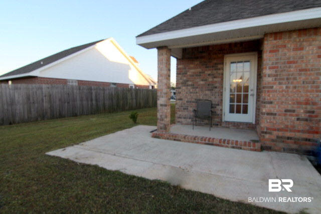 4005 Kendallbrook Loop Foley, AL 36535 - Photo 6 of 12 Covered and uncovered patio area in the back yard.