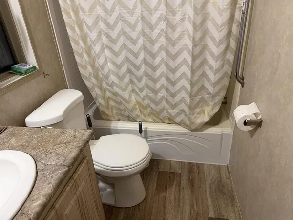 a bathroom with a toilet and a sink