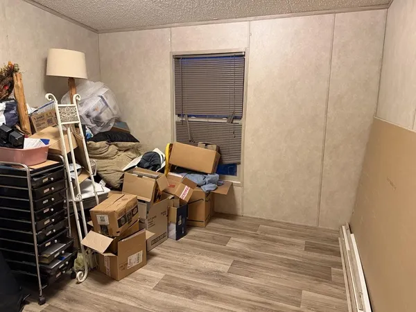 a room with furniture and a wooden floor