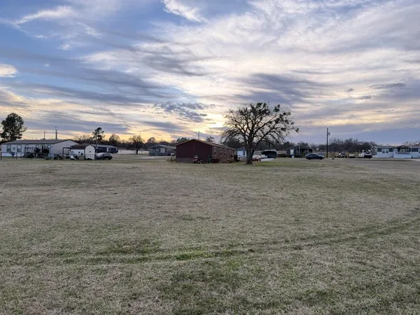 a view of a yard with an outdoor space