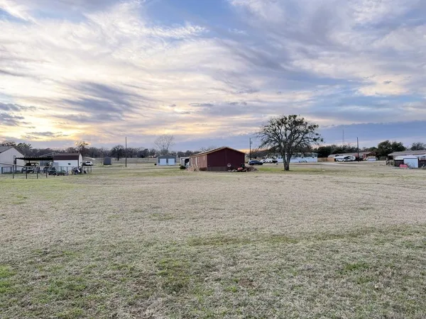 a view of a street with an outdoor space