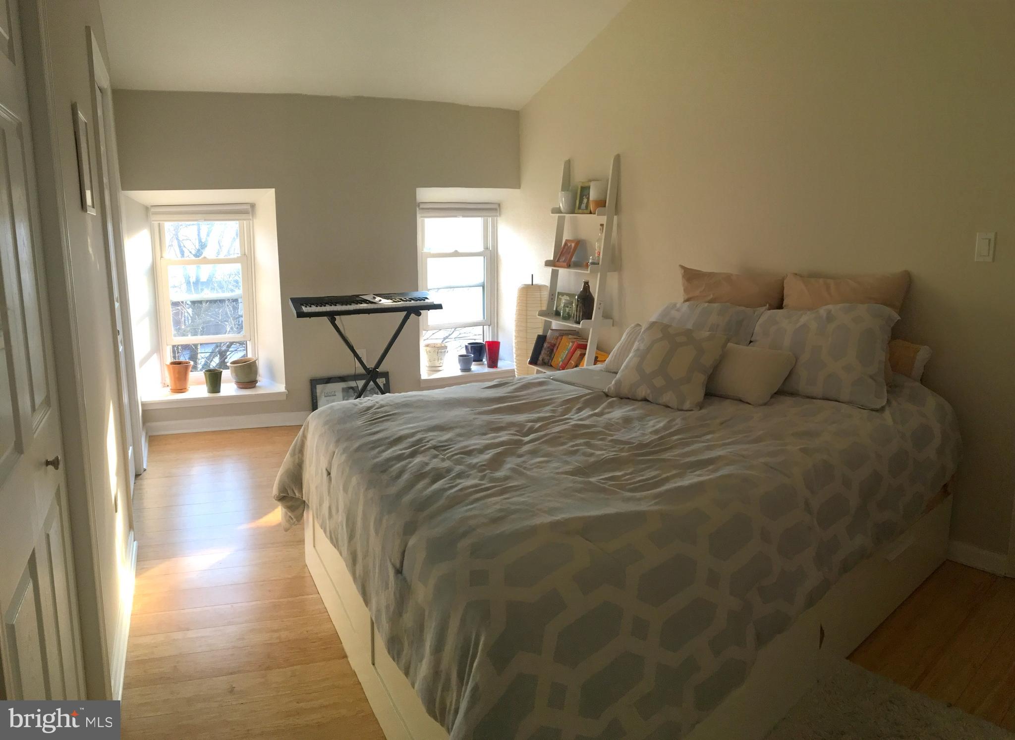 4203 Main Street, Unit 2 Philadelphia, PA 19127 - Photo 14 of 16 a bedroom with a bed and a window