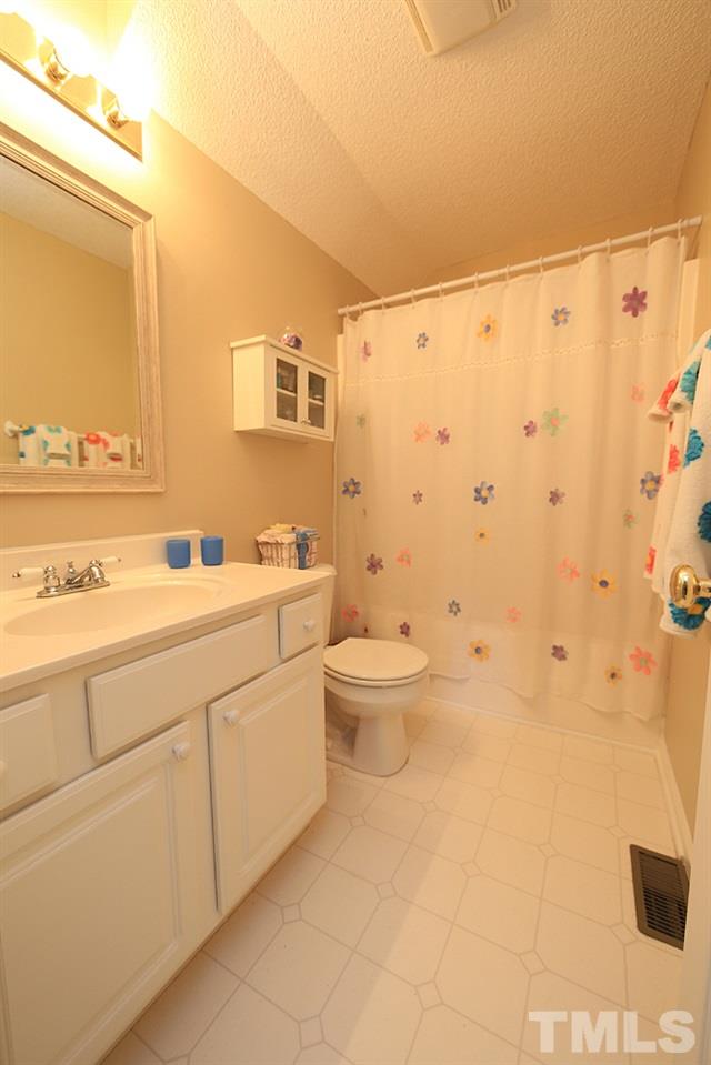 7321 Bonnie Ridge Court Raleigh, NC 27615 - Photo 10 of 14 Secondary bath upstairs