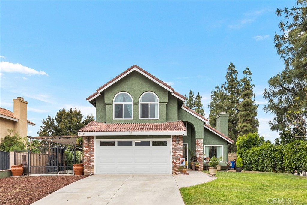 19458 Totem Court Riverside, CA 92508 - Photo 1 of 1 a front view of a house with garden