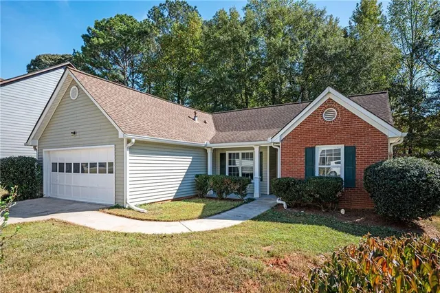 front view of a house with a yard