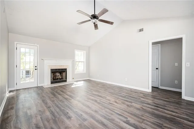 a view of a living room that has a fireplace