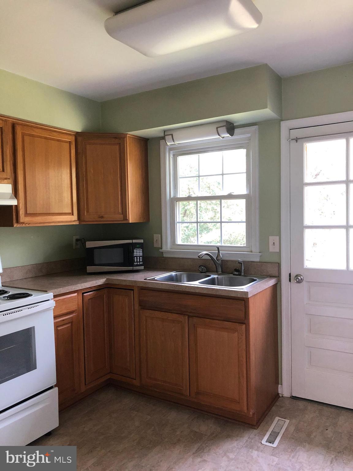 14296 Springfield Lane King George, VA 22485 - Photo 2 of 10 a kitchen with stainless steel appliances granite countertop a sink and a stove