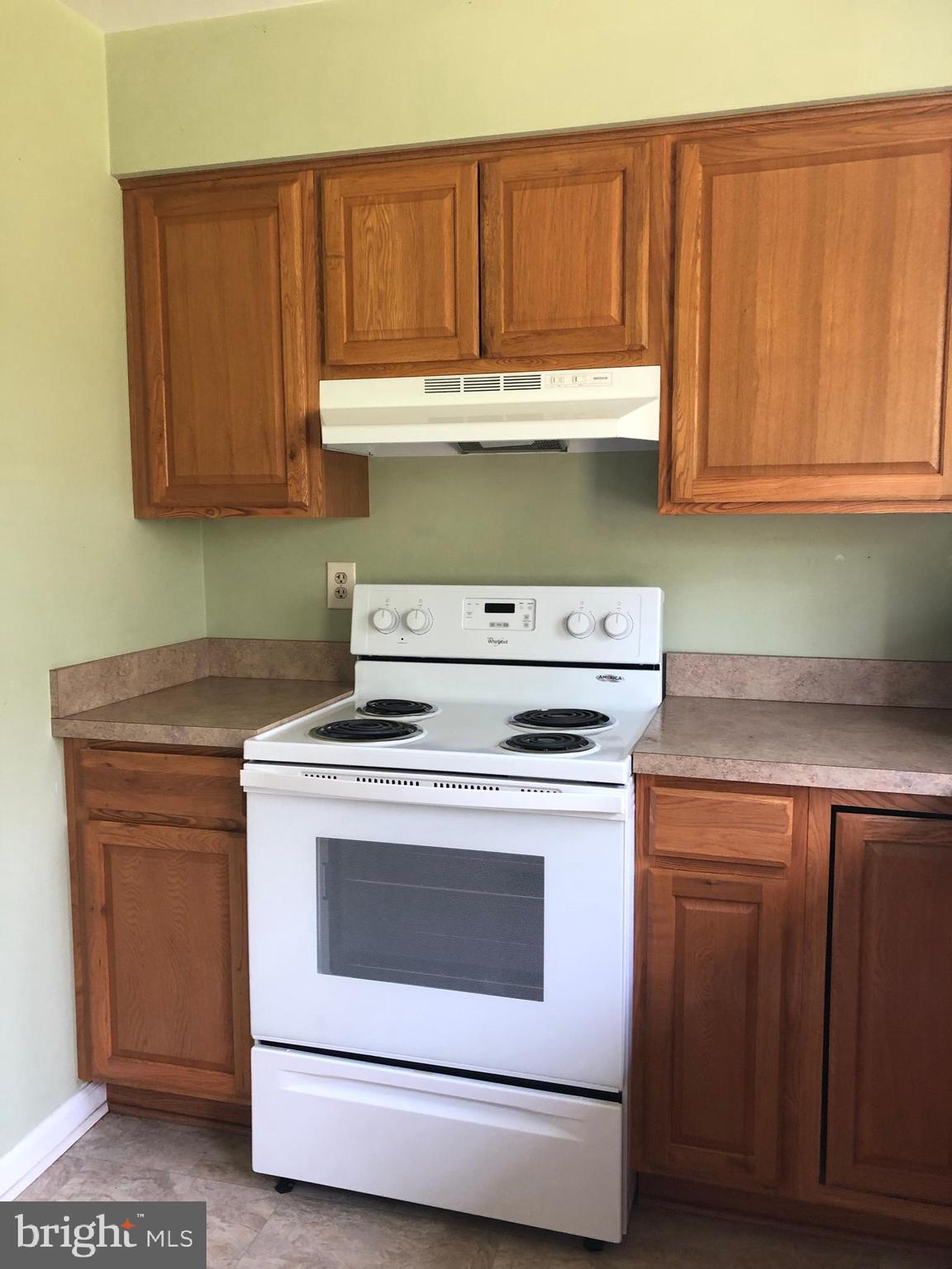 14296 Springfield Lane King George, VA 22485 - Photo 4 of 10 a kitchen with a stove and a sink