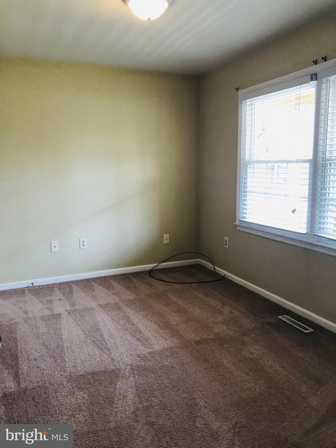 14296 Springfield Lane King George, VA 22485 - Photo 7 of 10 an empty room with a window