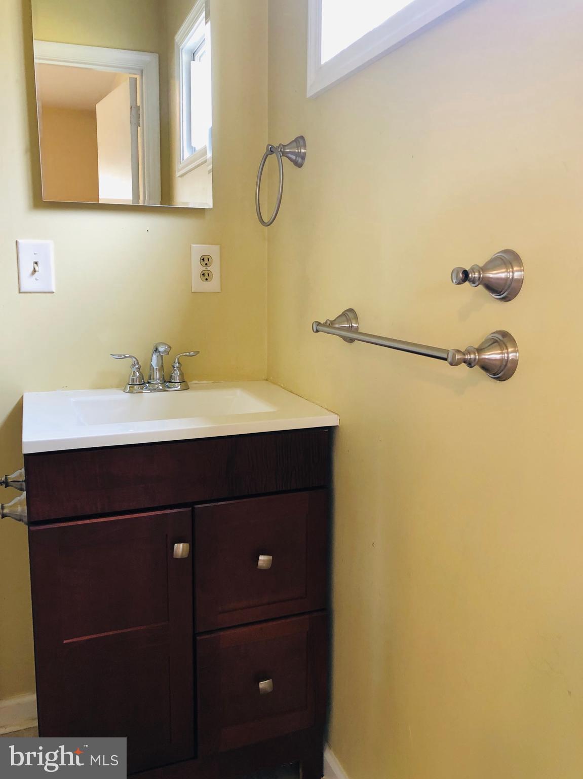 14296 Springfield Lane King George, VA 22485 - Photo 10 of 10 a bathroom with a sink and a mirror