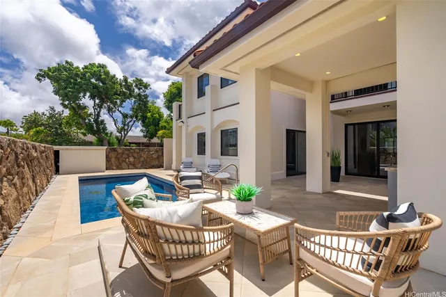 a view of a patio with furniture