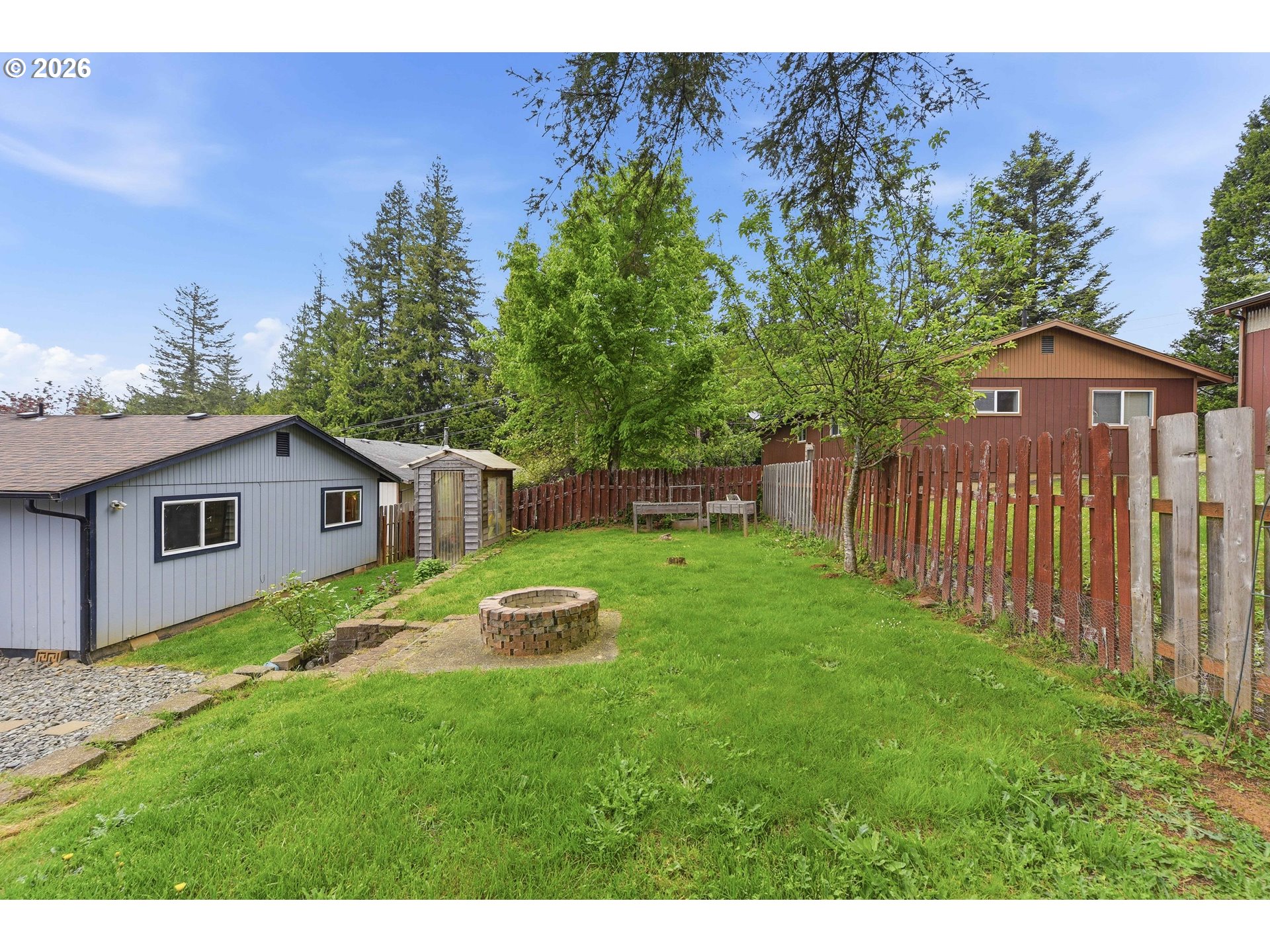 192 North Wood Ridge Road Coquille, OR 97423 - Photo 33 of 42 a view of backyard of house with wooden fence