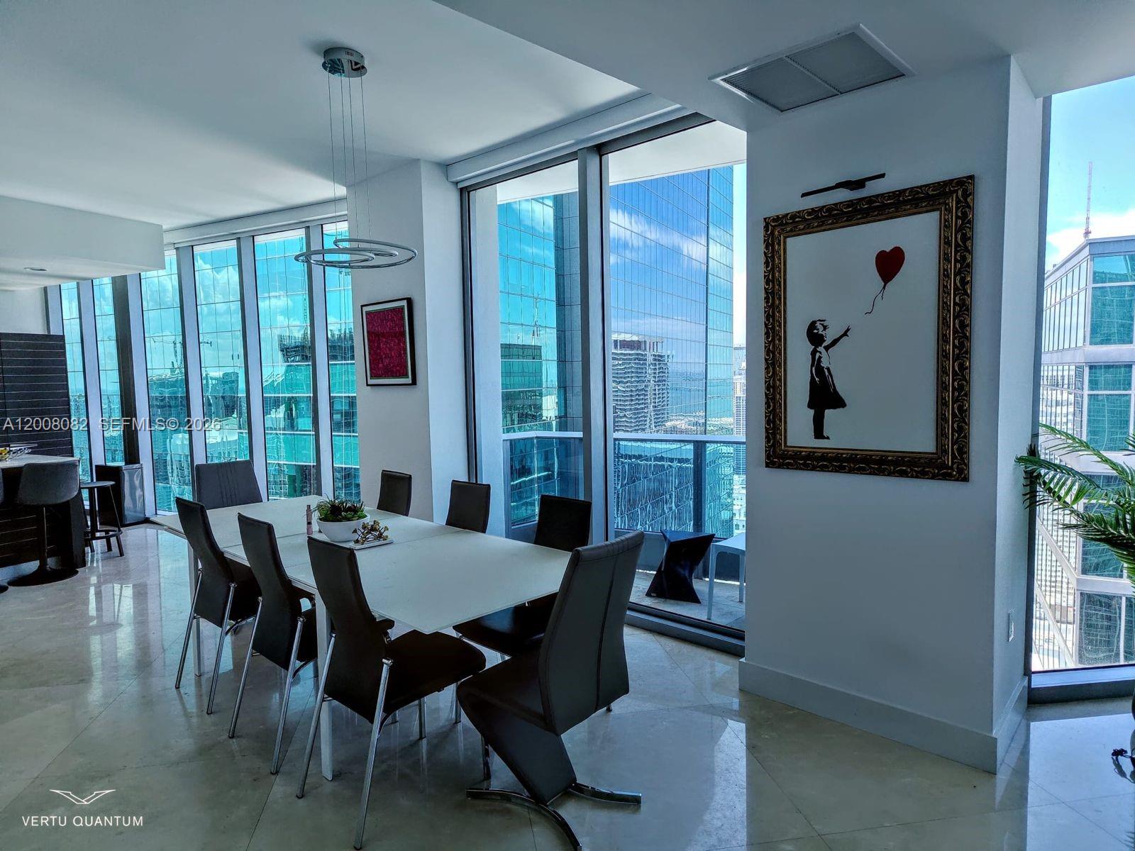 200 Biscayne Blvd Way, Unit 5001 Miami, FL 33131 - Photo 14 of 53 a view of a dining room with furniture window and outside view