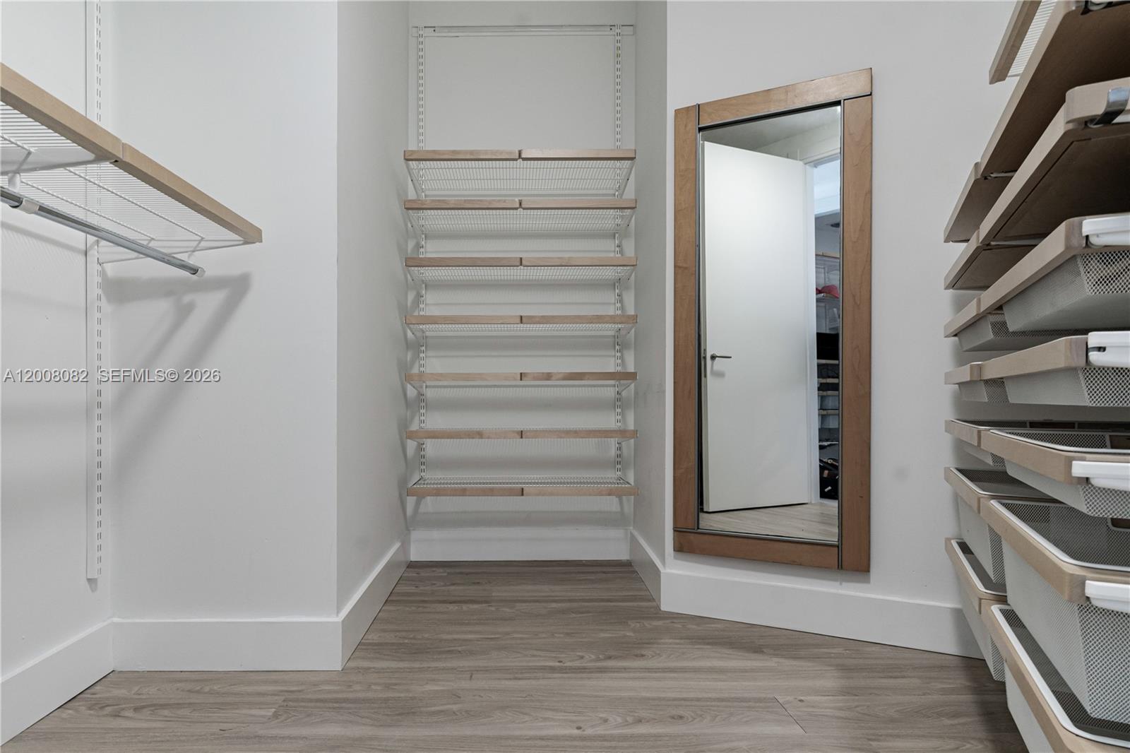 200 Biscayne Blvd Way, Unit 5001 Miami, FL 33131 - Photo 18 of 53 a view of walk in closet with empty racks