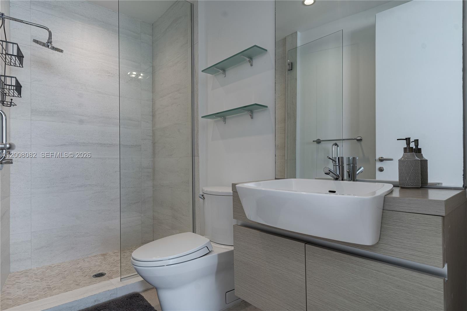 200 Biscayne Blvd Way, Unit 5001 Miami, FL 33131 - Photo 19 of 53 a white bath tub sitting next to a white toilet