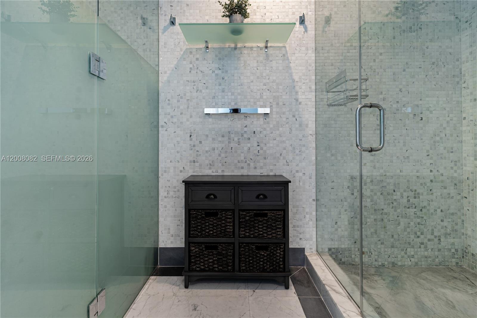 200 Biscayne Blvd Way, Unit 5001 Miami, FL 33131 - Photo 23 of 53 a bathroom with a shower and a sink