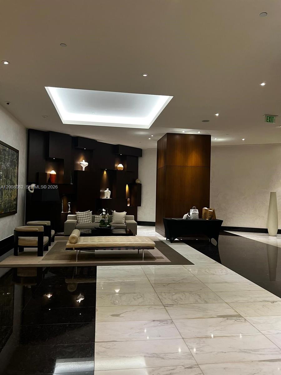 200 Biscayne Blvd Way, Unit 5001 Miami, FL 33131 - Photo 29 of 53 a lobby with a couch and tables
