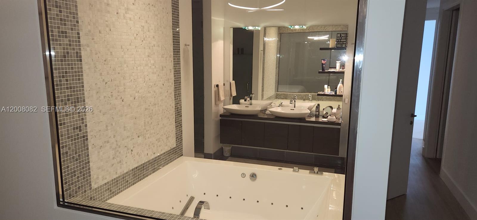 200 Biscayne Blvd Way, Unit 5001 Miami, FL 33131 - Photo 30 of 53 a bathroom with a sink and a mirror