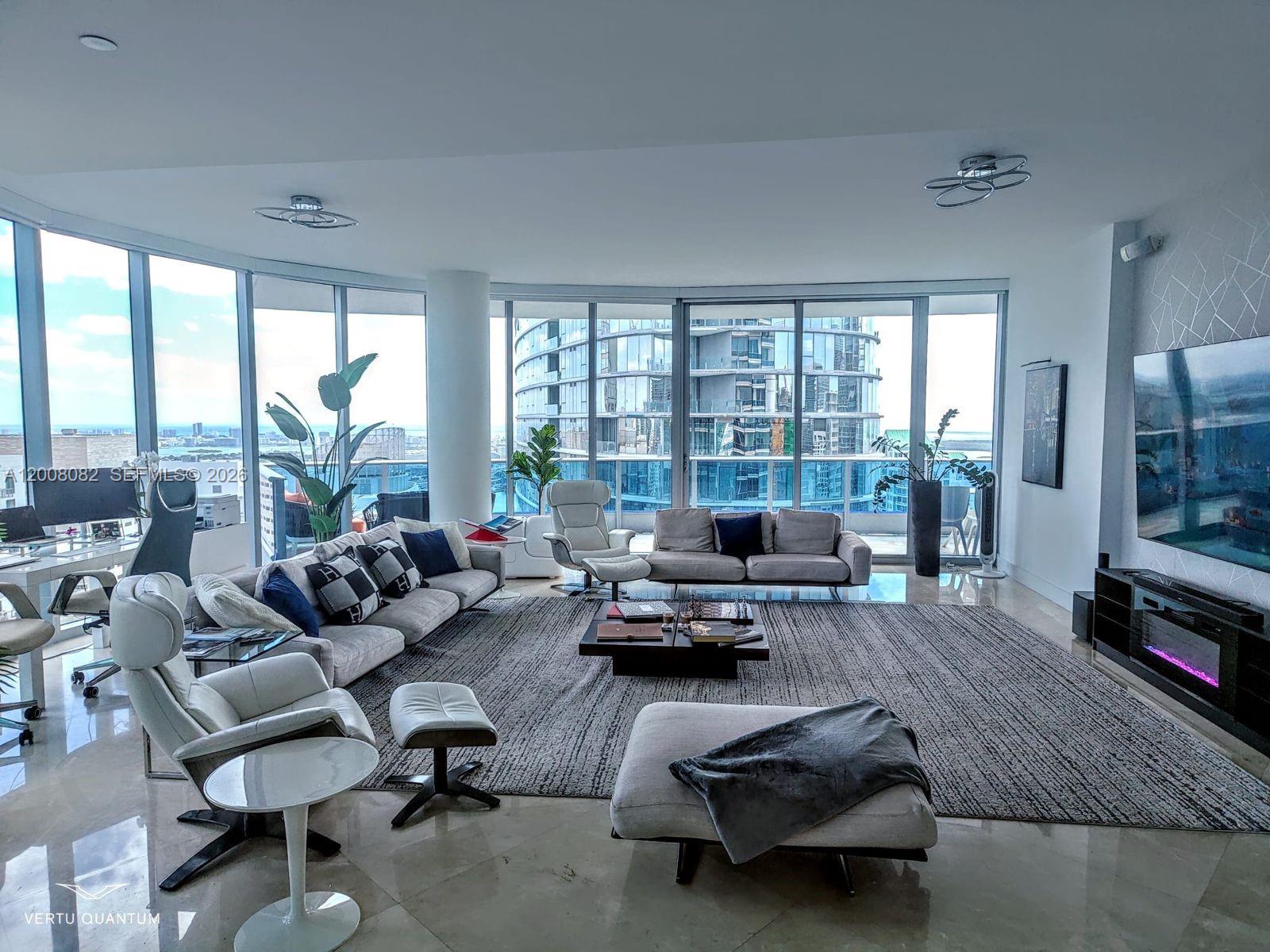200 Biscayne Blvd Way, Unit 5001 Miami, FL 33131 - Photo 3 of 53 a living room with furniture and floor to ceiling windows