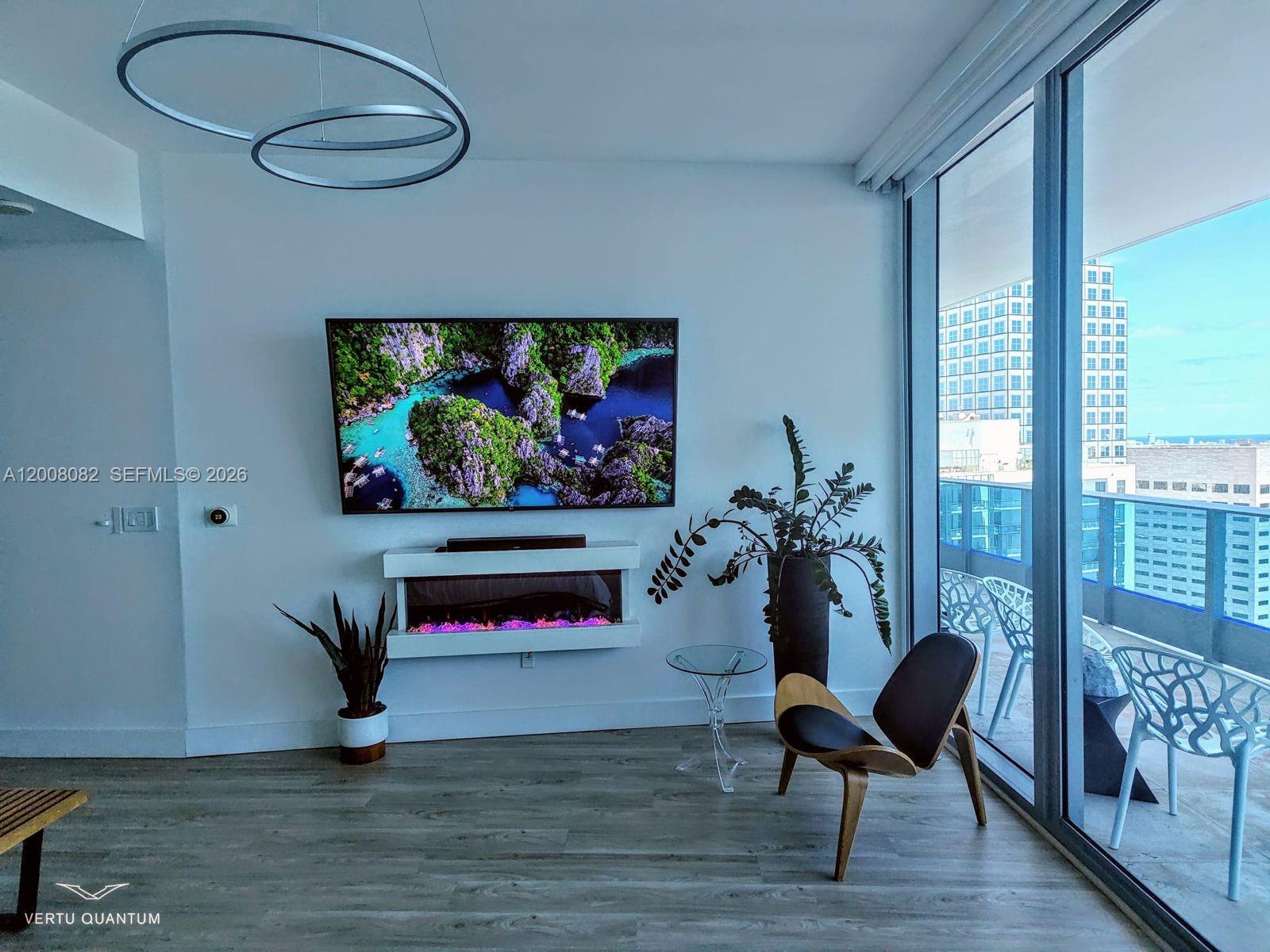 200 Biscayne Blvd Way, Unit 5001 Miami, FL 33131 - Photo 39 of 53 a living room with furniture and a potted plant