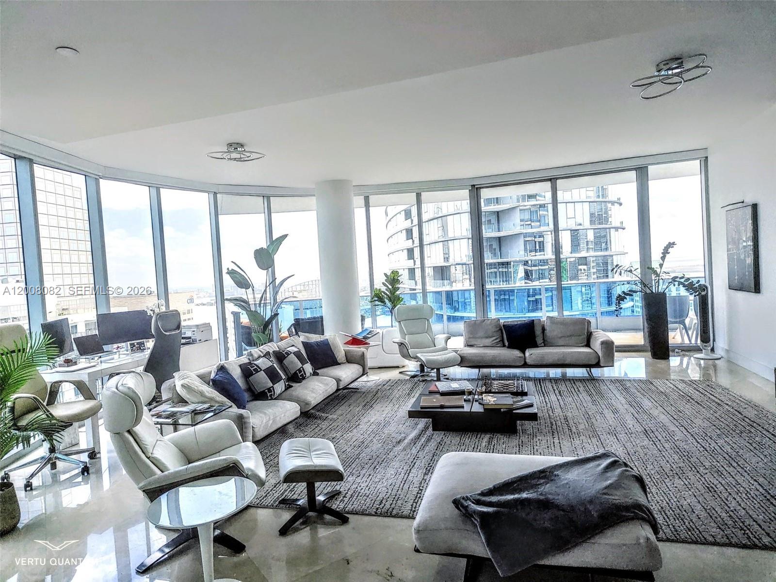 200 Biscayne Blvd Way, Unit 5001 Miami, FL 33131 - Photo 4 of 53 a living room with furniture and a large window