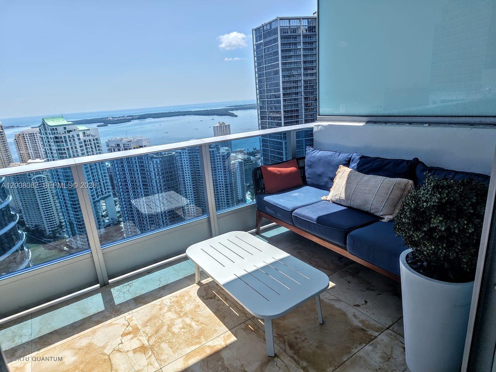 200 Biscayne Blvd Way, Unit 5001 Miami, FL 33131 - Photo 43 of 53 a couch sitting on a rug next to a window
