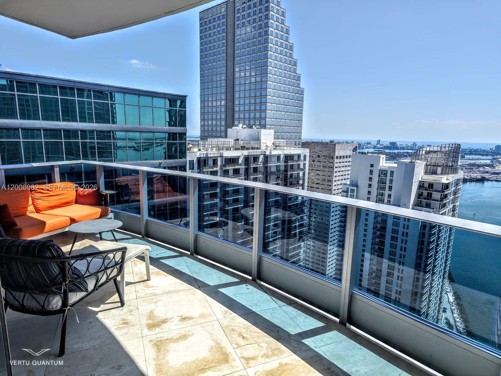 200 Biscayne Blvd Way, Unit 5001 Miami, FL 33131 - Photo 45 of 53 a view of a balcony with chairs