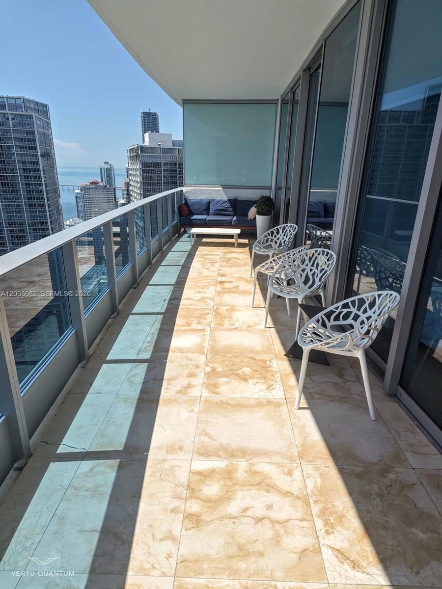 200 Biscayne Blvd Way, Unit 5001 Miami, FL 33131 - Photo 46 of 53 a view of balcony with seating space and hardwood floor