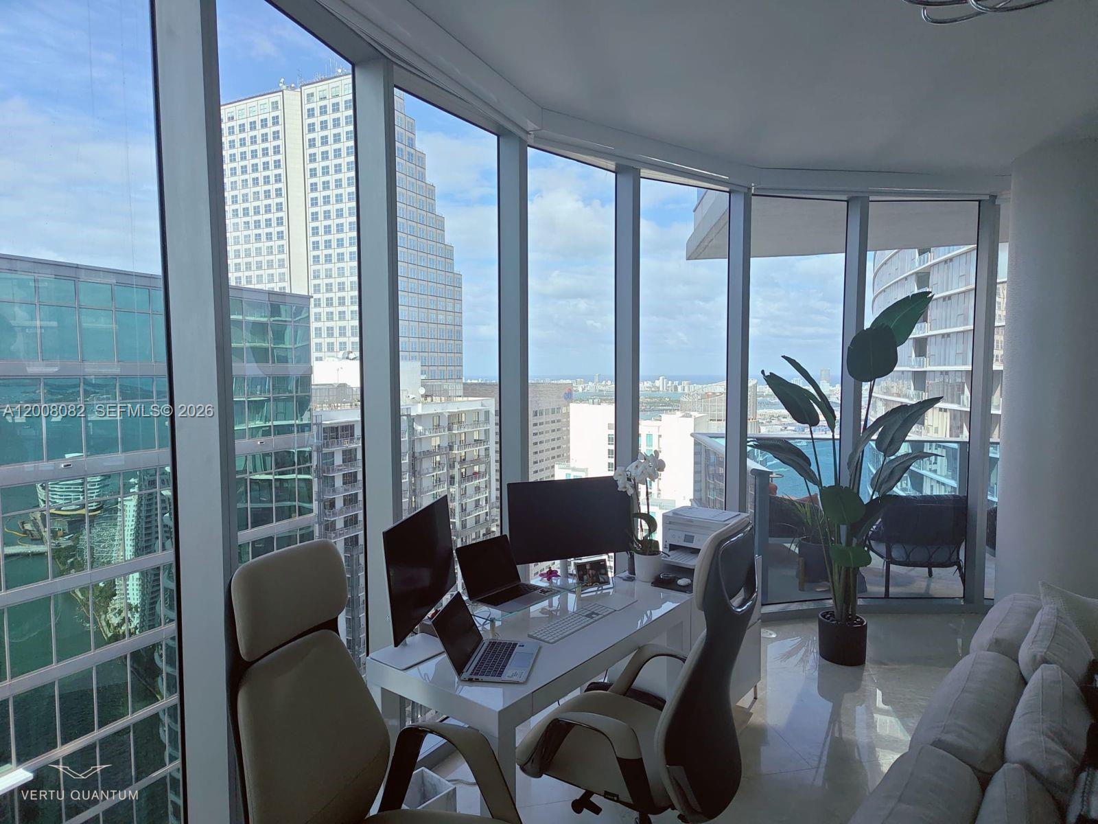 200 Biscayne Blvd Way, Unit 5001 Miami, FL 33131 - Photo 9 of 53 a view of a livingroom with furniture and large windows