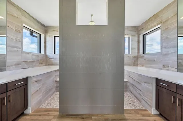 a bathroom with a granite countertop sink a mirror and a