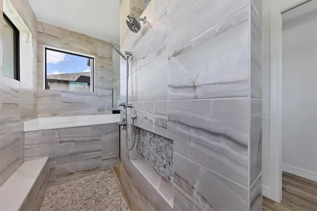 a bathroom with a shower and a sink