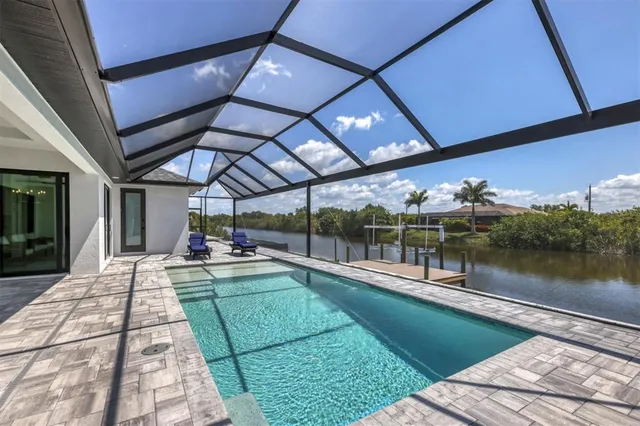 a view of a swimming pool with a patio